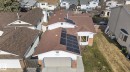 Property featuring a brown shingle roof with multiple solar panel installations - 8403 190 Street, Edmonton, AB  - Outdoor 