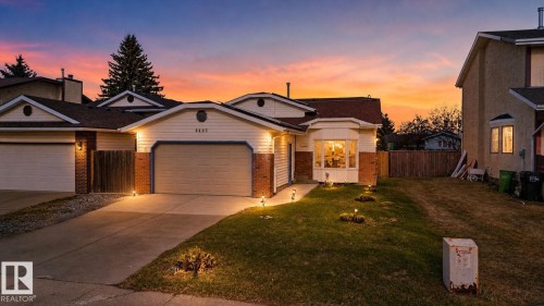 Ranch-style exterior with brick accents, bay window, and a prominent front-facing garage - 8403 190 Street, Edmonton, AB - Outdoor