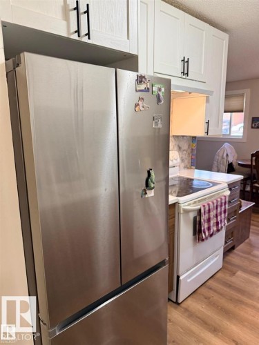 Stainless steel French door refrigerator - 106 10725 111 Street, Edmonton, AB - Indoor Photo Showing Kitchen