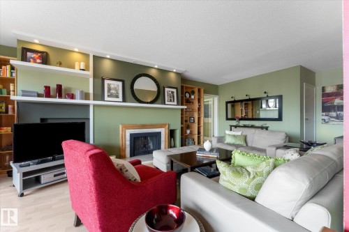 1105 9809 110 Street, Edmonton, AB - Indoor Photo Showing Living Room With Fireplace
