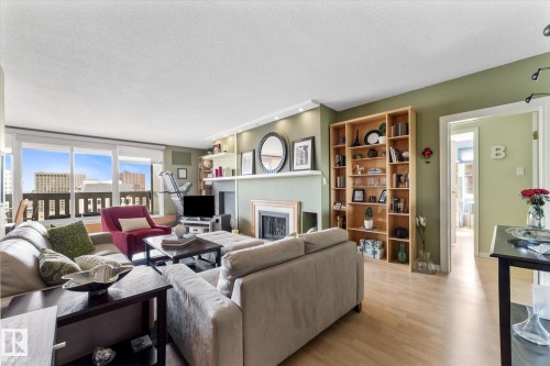 1105 9809 110 Street, Edmonton, AB - Indoor Photo Showing Living Room With Fireplace