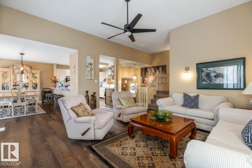 Spacious living area featuring wood-finish flooring and a high vaulted ceiling - 47 1130 Falconer Road, Edmonton, AB - Indoor Photo Showing Living Room