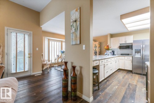 Spacious kitchen with light-toned cabinetry, stainless steel appliances, and a granite-look countertop - 47 1130 Falconer Road, Edmonton, AB - Indoor Photo Showing Kitchen