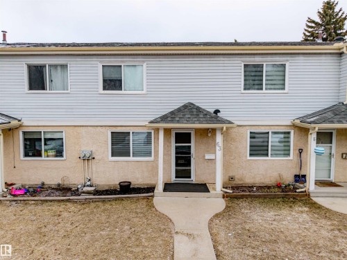 The property features a concrete walkway leading to the front entrance, which is sheltered by a covered porch - Sherwood Park, AB - Outdoor With Facade