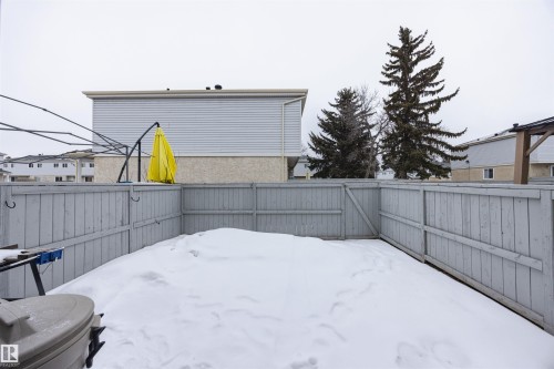 The property features a fenced yard with a snow-covered ground - Sherwood Park, AB - Outdoor