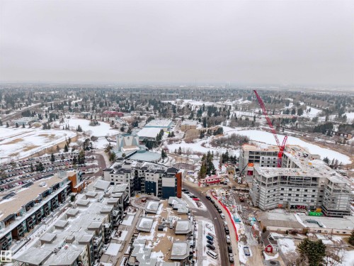 Aerial view of the surrounding area featuring established buildings and trees, along with ongoing construction - Sherwood Park, AB - Outdoor With View