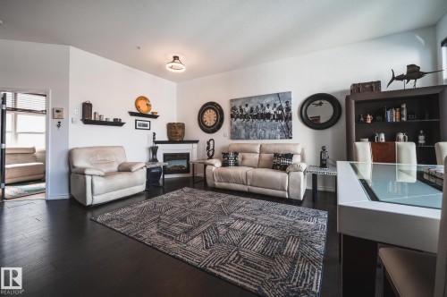 412 9503 101 Avenue, Edmonton, AB - Indoor Photo Showing Living Room With Fireplace
