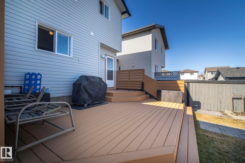 Multi-level deck featuring composite decking, privacy screen, and direct access to the interior - 65 Birchmont Drive, Leduc, AB - Outdoor With Deck Patio Veranda With Exterior
