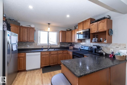 65 Birchmont Drive, Leduc, AB - Indoor Photo Showing Kitchen With Double Sink