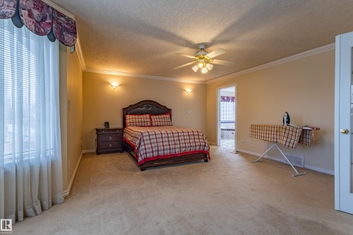 Spacious room featuring neutral wall tones and crown molding - 195 Kulawy Drive, Edmonton, AB - Indoor Photo Showing Bedroom