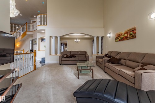 Spacious living area featuring high ceilings and neutral wall tones - 195 Kulawy Drive, Edmonton, AB - Indoor Photo Showing Living Room