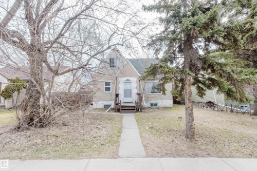 Single-family home with a stucco exterior and gabled roofline - 12223 127 Street, Edmonton, AB - Outdoor