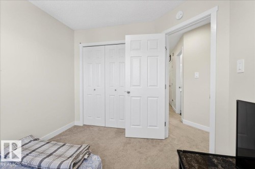 Neutral tone painted walls and carpeted flooring define this room - 5315 22 Avenue, Edmonton, AB - Indoor Photo Showing Bedroom