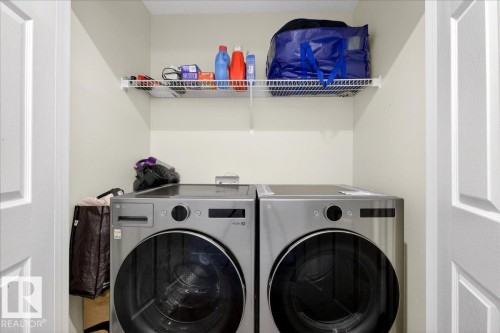 Dedicated laundry area featuring a white wire shelving unit, providing elevated storage capacity - 5315 22 Avenue, Edmonton, AB - Indoor Photo Showing Laundry Room
