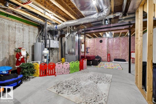 Unfinished basement featuring exposed joists, concrete flooring, and partial insulation - 5315 22 Avenue, Edmonton, AB - Indoor Photo Showing Basement