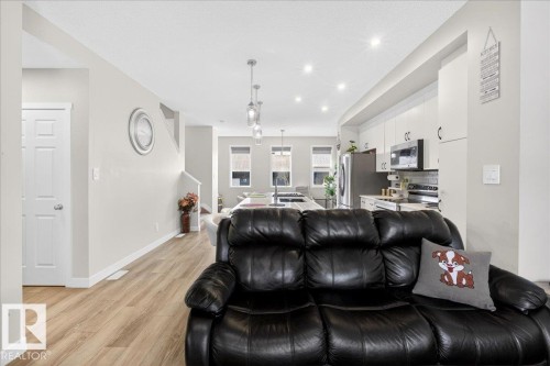 Open-concept main living area with wood-finish flooring - 5315 22 Avenue, Edmonton, AB - Indoor