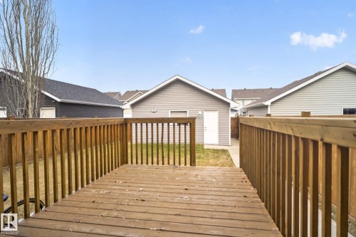 Expansive wood deck with full baluster railing - 6912 22 Avenue, Edmonton, AB - Outdoor With Exterior