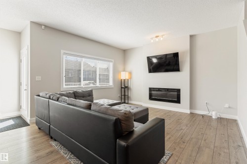 8011 Evans Crescent, Edmonton, AB - Indoor Photo Showing Living Room With Fireplace