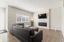 8011 Evans Crescent, Edmonton, AB  - Indoor Photo Showing Living Room With Fireplace 