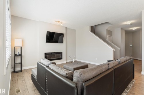 8011 Evans Crescent, Edmonton, AB - Indoor Photo Showing Living Room With Fireplace