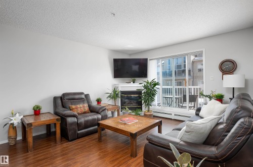 340 17447 98A Avenue, Edmonton, AB - Indoor Photo Showing Living Room With Fireplace