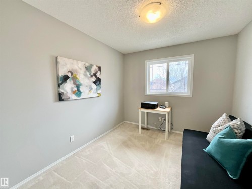 Room featuring a single window with white trim, light gray painted walls, and light-colored patterned carpeting - 17936 85 Street, Edmonton, AB - Indoor