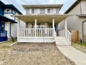 Two-story residence featuring light gray siding and white window shutters - 17936 85 Street, Edmonton, AB  - Outdoor With Deck Patio Veranda 