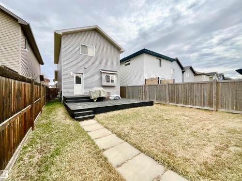 Two-story residence with light gray siding and a dark gabled roof - 17936 85 Street, Edmonton, AB - Outdoor With Deck Patio Veranda With Exterior