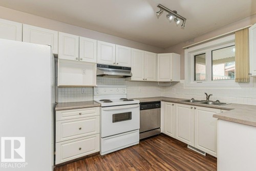 101 10809 Saskatchewan Drive, Edmonton, AB - Indoor Photo Showing Kitchen With Double Sink