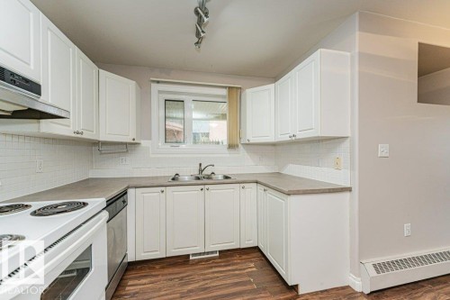 101 10809 Saskatchewan Drive, Edmonton, AB - Indoor Photo Showing Kitchen With Double Sink