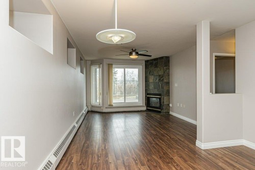 101 10809 Saskatchewan Drive, Edmonton, AB - Indoor Photo Showing Other Room With Fireplace
