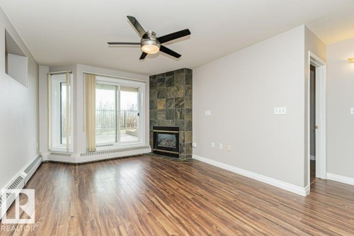 101 10809 Saskatchewan Drive, Edmonton, AB - Indoor Photo Showing Other Room With Fireplace