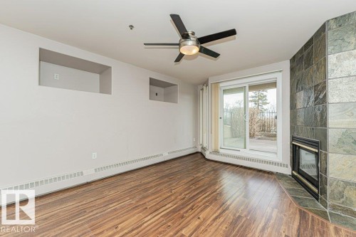 101 10809 Saskatchewan Drive, Edmonton, AB - Indoor Photo Showing Other Room With Fireplace