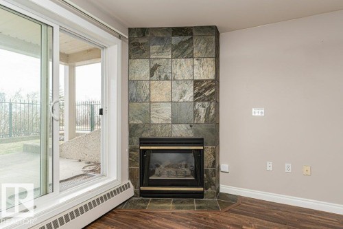 101 10809 Saskatchewan Drive, Edmonton, AB - Indoor Photo Showing Living Room With Fireplace