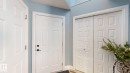 Entryway featuring light blue walls, white trim, and white doors - 3613 11 Street, Edmonton, AB  - Indoor Photo Showing Other Room 
