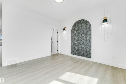 Bright interior space featuring light wood-finish flooring - 4006 35 St, Beaumont, AB - Indoor Photo Showing Other Room