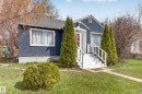 Charming single-story residence with a blue stucco exterior and white trim - 8722 112 Avenue, Edmonton, AB  - Outdoor 