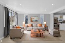 Open-concept living area featuring light wood-finish flooring, recessed lighting, and crisp white trim - 8722 112 Avenue, Edmonton, AB  - Indoor Photo Showing Living Room 