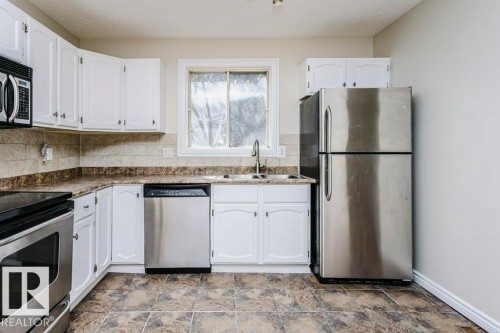 14304 32 Street, Edmonton, AB - Indoor Photo Showing Kitchen With Double Sink