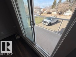Sliding glass patio door opening to an outdoor balcony - 