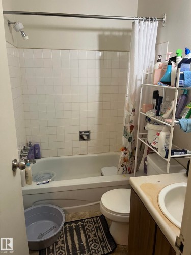 White tiled bath surround with a shower/tub combination - 68 11265 31 Avenue, Edmonton, AB - Indoor Photo Showing Bathroom