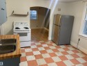 Eat-in kitchen - 9747 90 Avenue, Edmonton, AB  - Indoor Photo Showing Kitchen With Double Sink 
