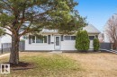 Single-story residence featuring white horizontal siding and a light gray shingle roof - 13107 133 Street, Edmonton, AB  - Outdoor 