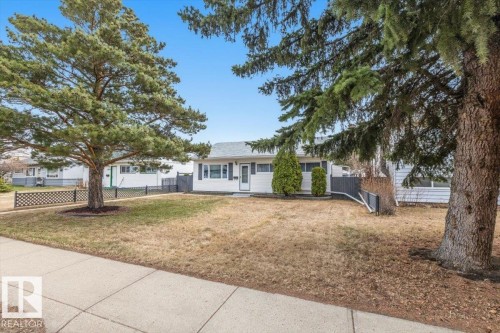 White siding exterior with a dark grey shingle roof - 13107 133 Street, Edmonton, AB - Outdoor