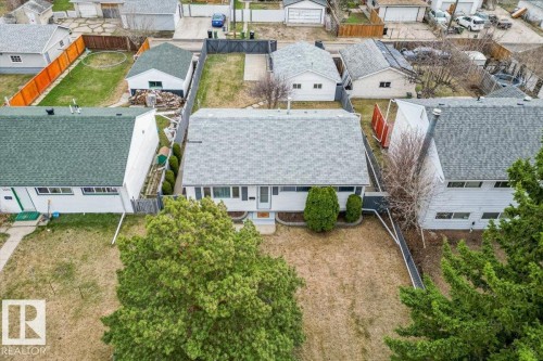 Single-story residence featuring a gray shingle roof and a white exterior facade - 13107 133 Street, Edmonton, AB - Outdoor With Deck Patio Veranda