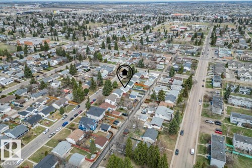 Aerial depiction of a residential area featuring a grid pattern of streets and numerous detached homes with varying roof styles - 13107 133 Street, Edmonton, AB - Outdoor With View