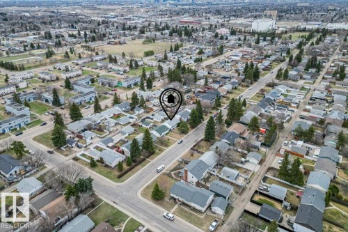 Aerial perspective showcasing a residential area with various housing types and mature trees - 13107 133 Street, Edmonton, AB - Outdoor With View