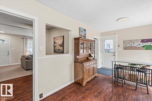 Interior space featuring wood-finish flooring and wainscoting - 13107 133 Street, Edmonton, AB - Indoor Photo Showing Other Room