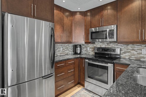 210 2204 44 Avenue, Edmonton, AB - Indoor Photo Showing Kitchen With Stainless Steel Kitchen With Double Sink With Upgraded Kitchen
