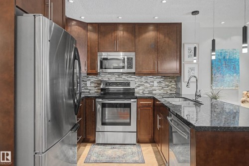 210 2204 44 Avenue, Edmonton, AB - Indoor Photo Showing Kitchen With Stainless Steel Kitchen With Double Sink With Upgraded Kitchen